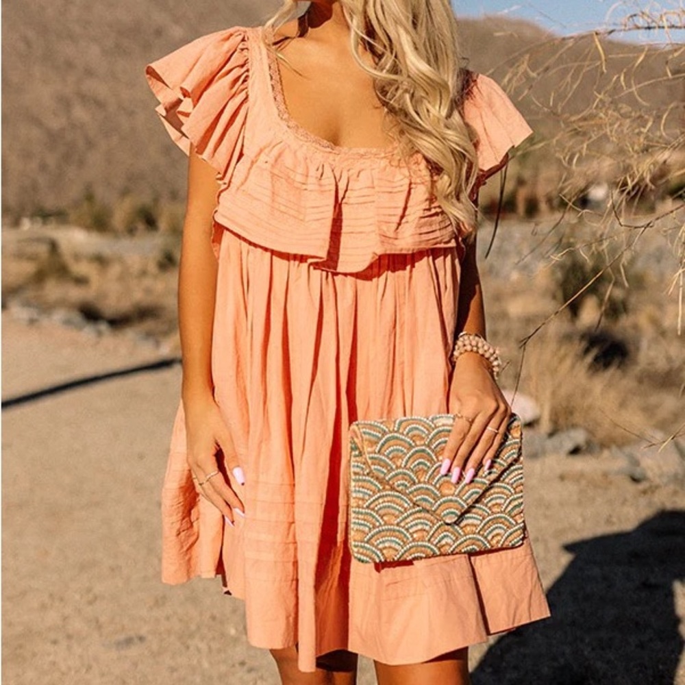 Peach colored backless mini dress